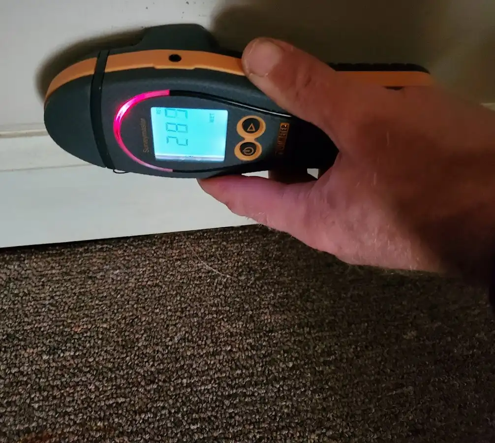 Moisture detection at baseboard during Storm Damage Restoration in El Dorado